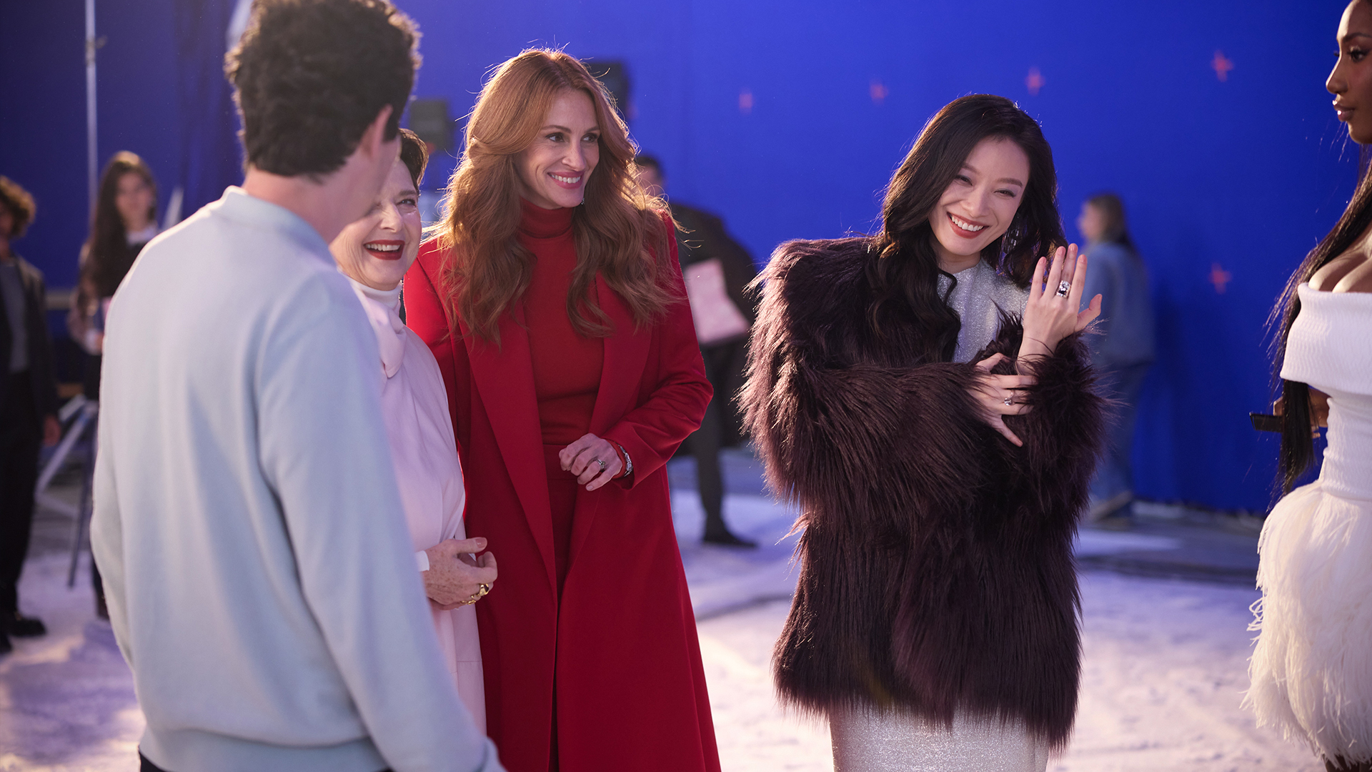 The cast between takes on the winter set of the campaign.